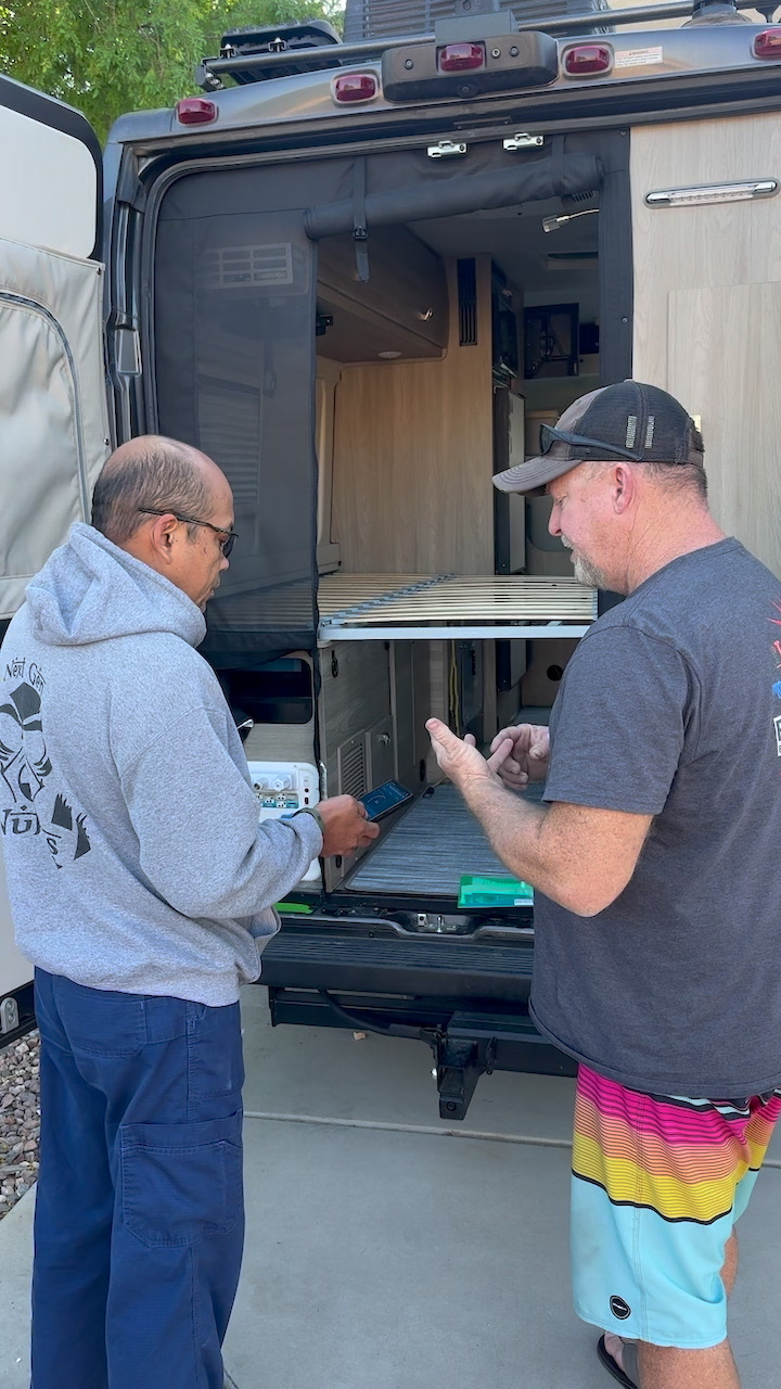 Tucson RV Solar technician discussing power needs with a customer