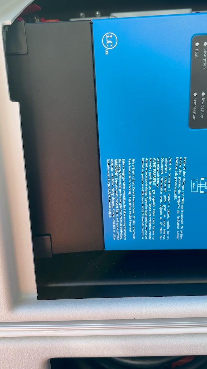 Victron inverter/charger correctly mounted in an RV electrical compartment